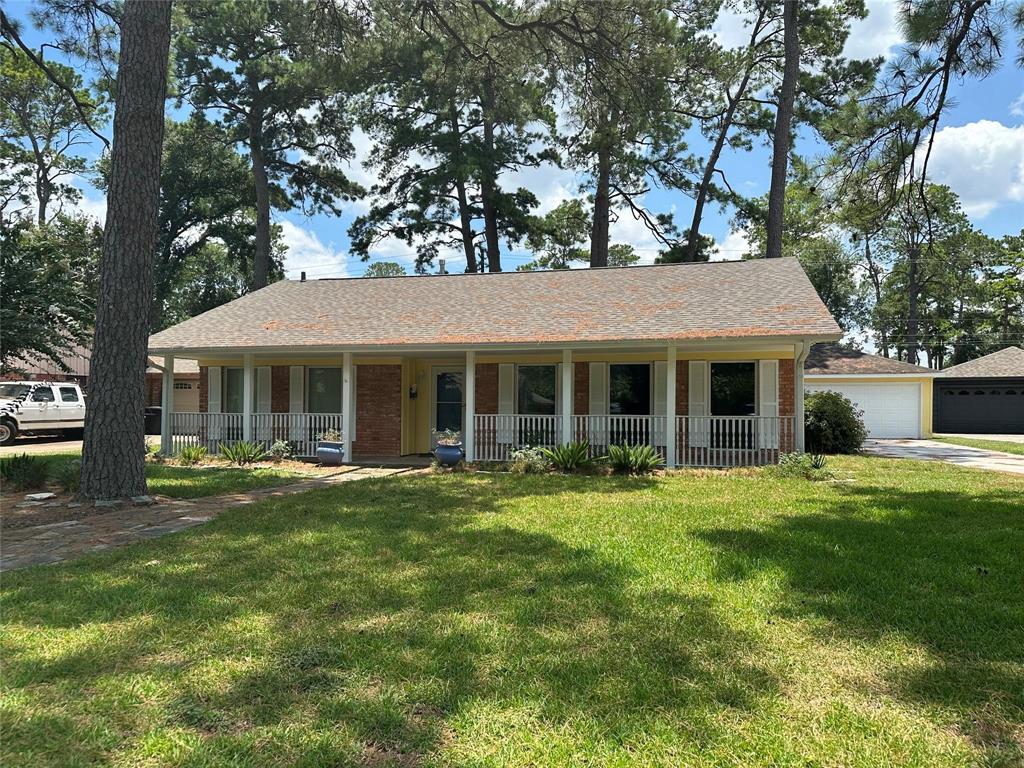 a front view of a house with a garden and porch