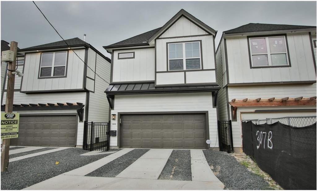 a front view of a house with garage