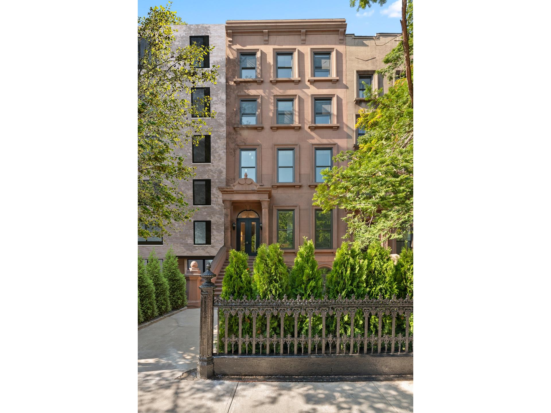 a view of a brick building next to a yard