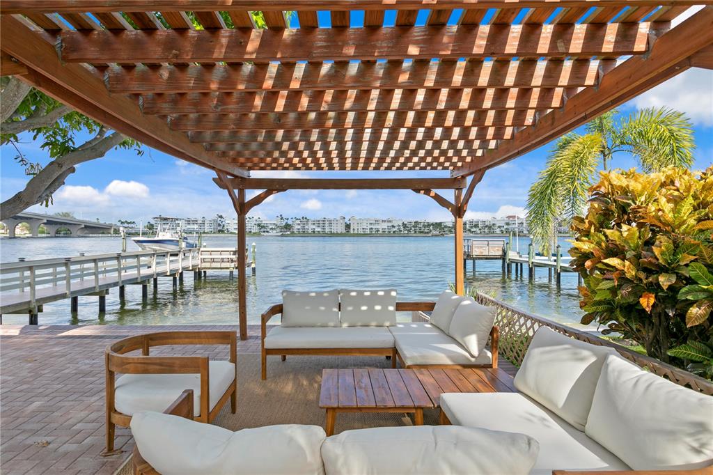 a balcony with furniture and wooden floor