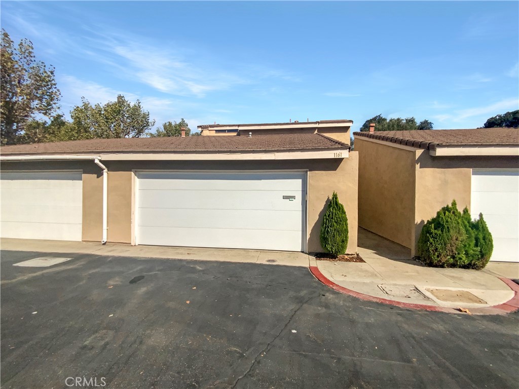 a view of a house with a garage