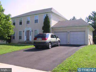 a car parked in front of a house