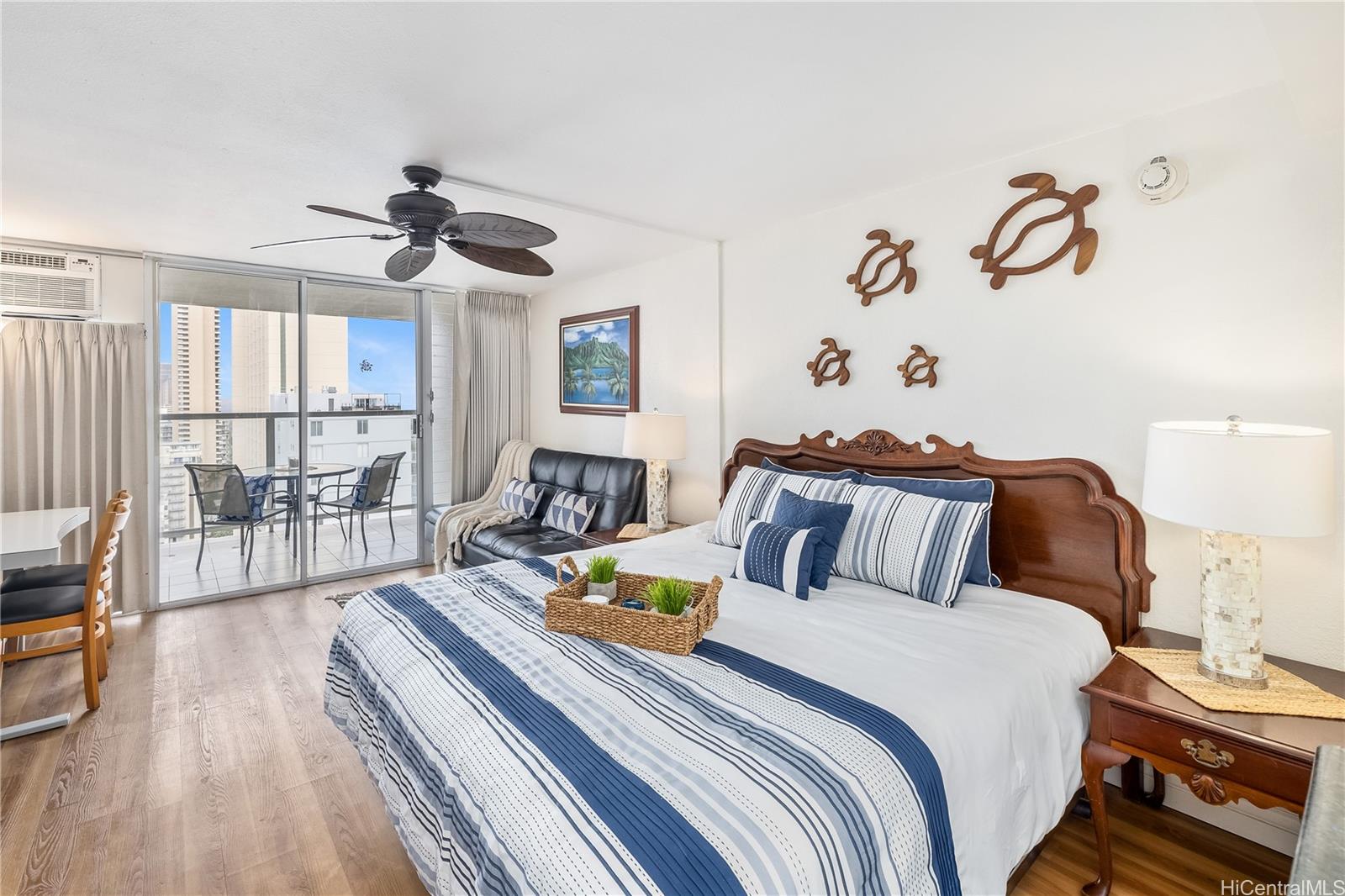 a bedroom with bed and a chandelier