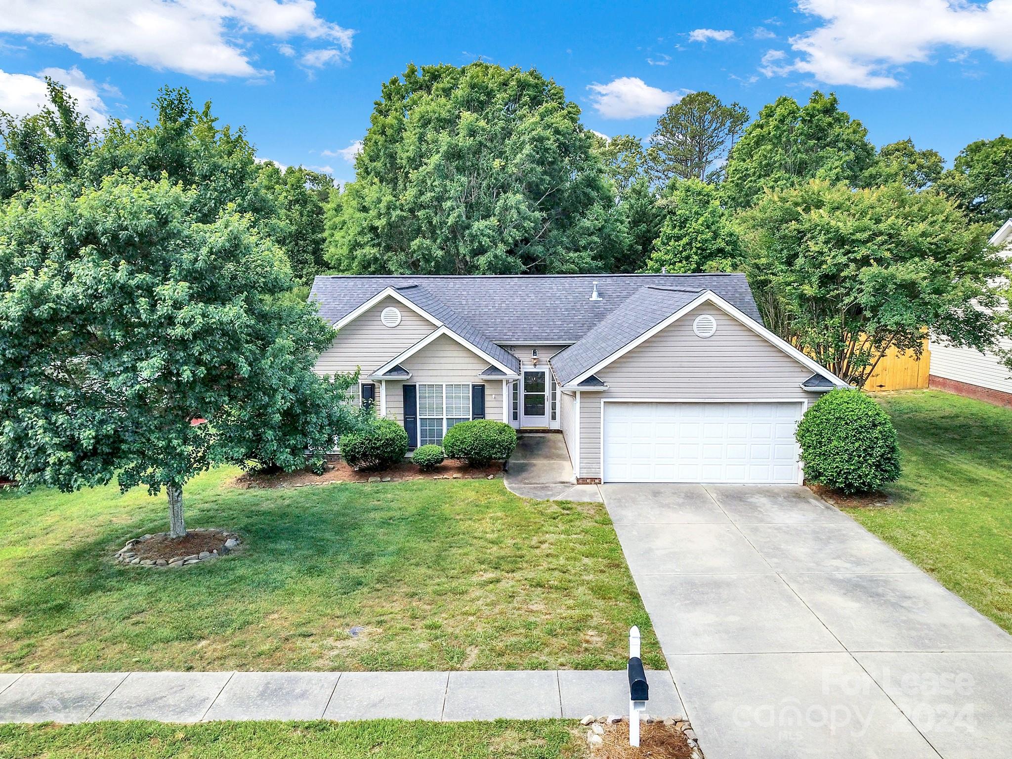 front view of a house with a yard