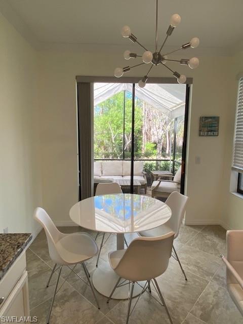 a view of a dining room with furniture window and outside view