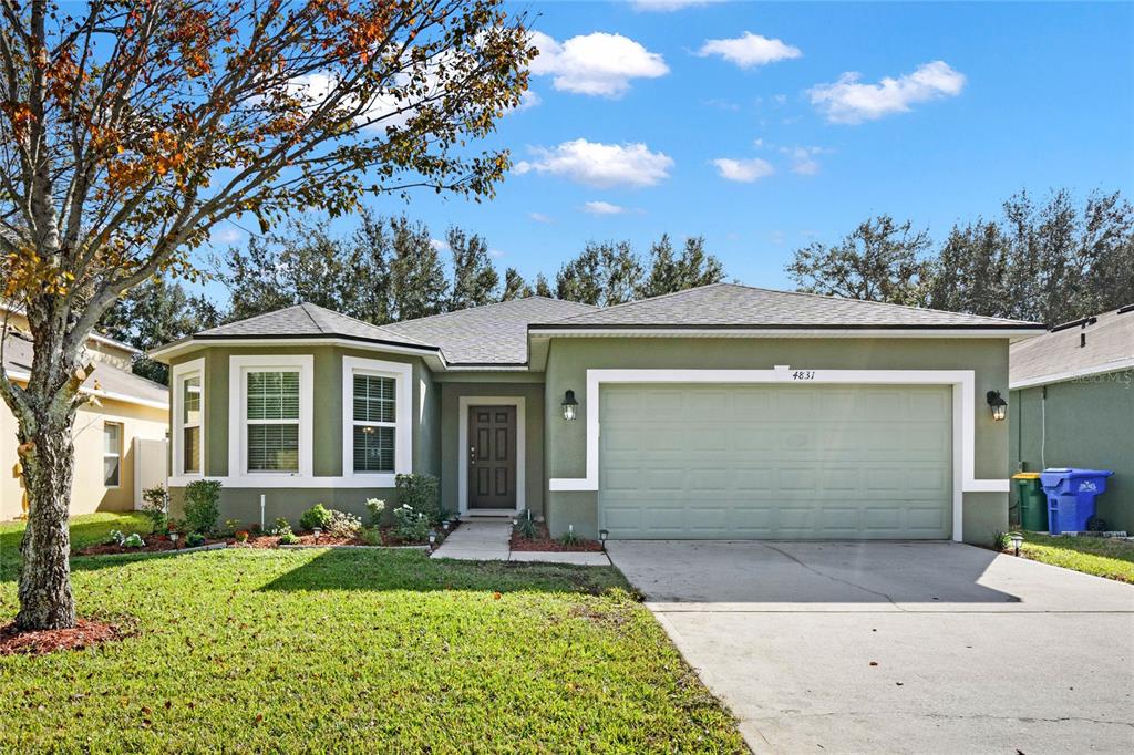 front view of a house with a yard