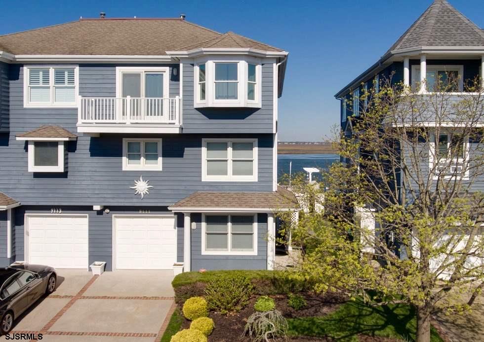 This stunning Long Beach Island home offers unobstructed views of